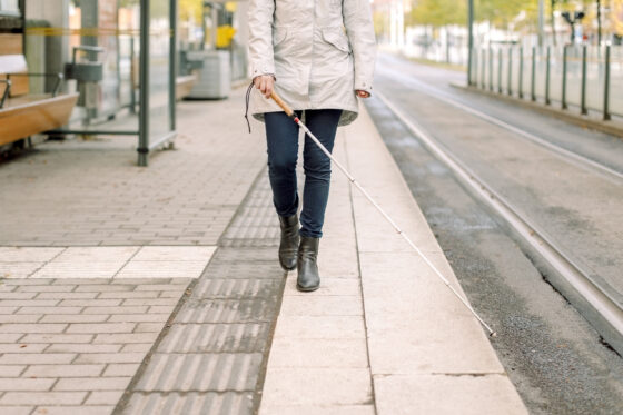 European City: photo of a cane along a tactile yellow line